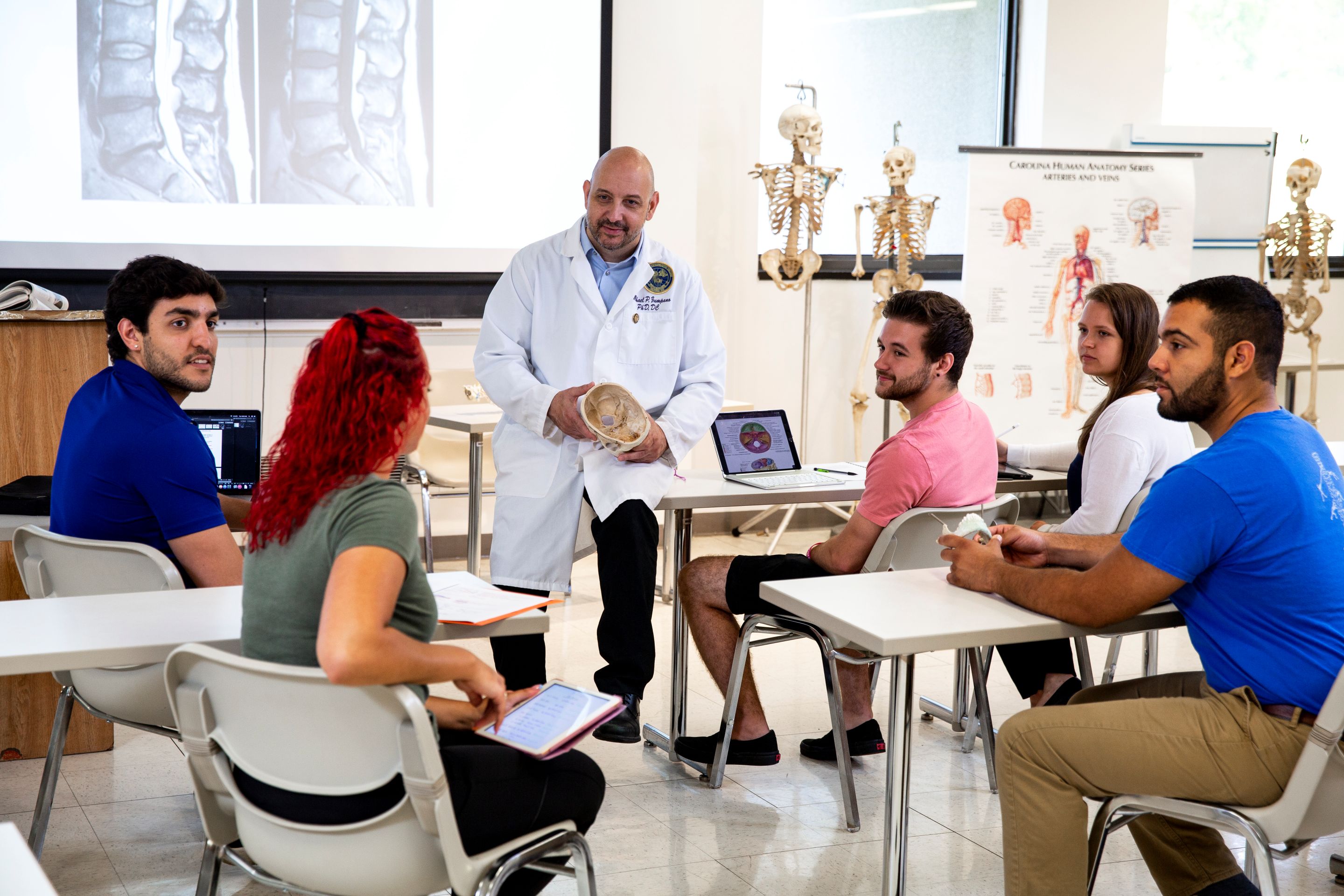 Dr. Zumpano in a classroom instructing students