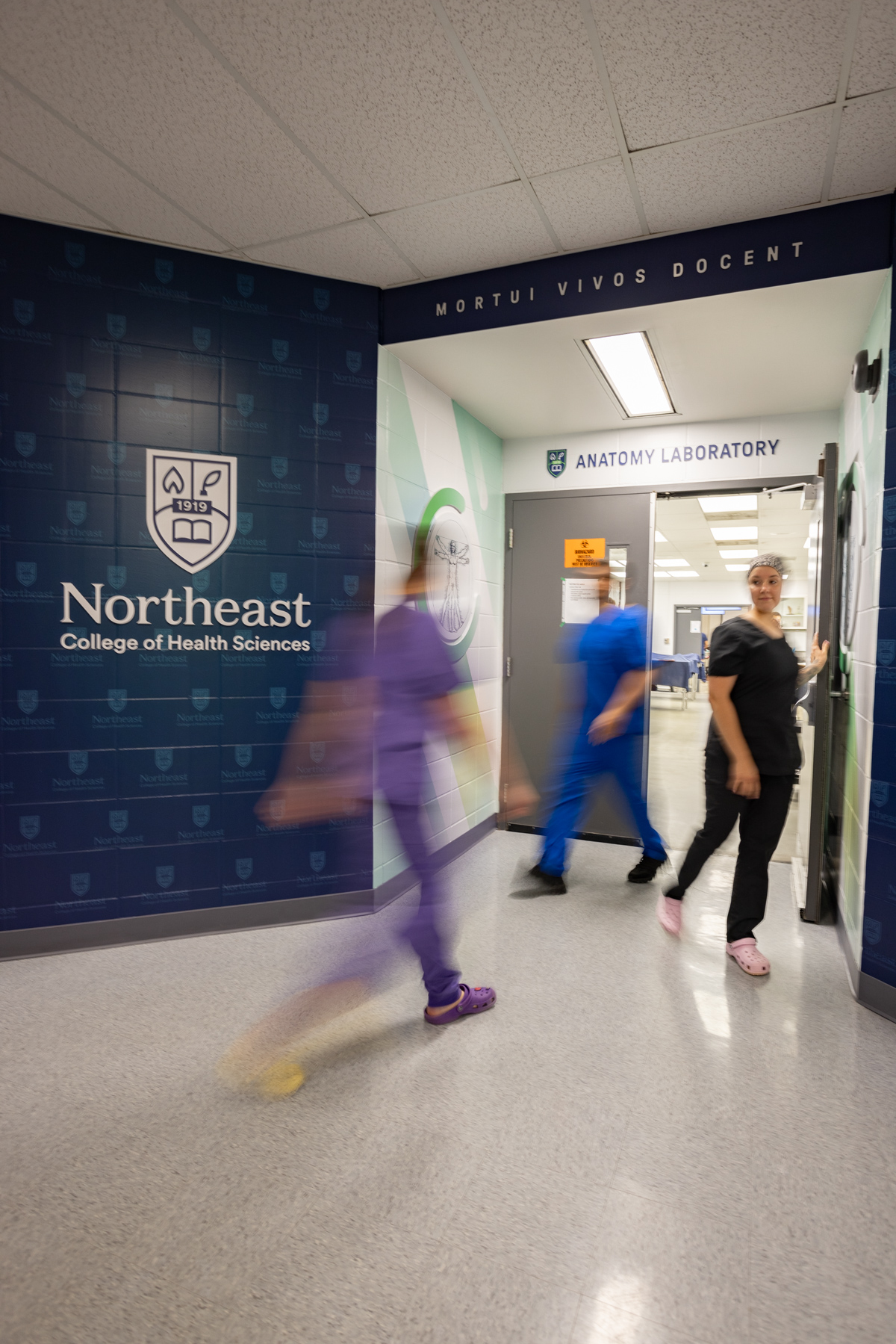 students walking through anatomy center