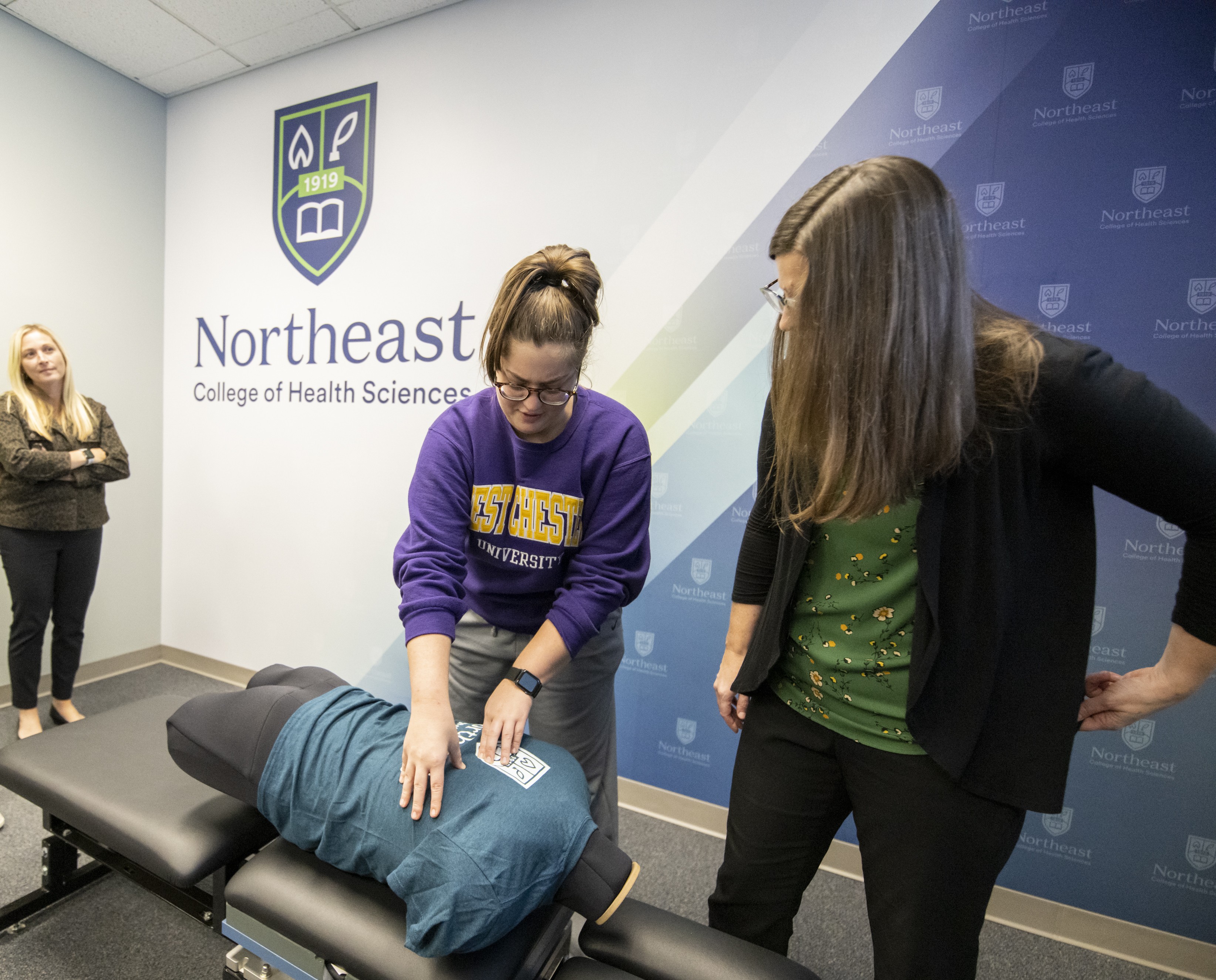 Student participating in chiropractic instruction