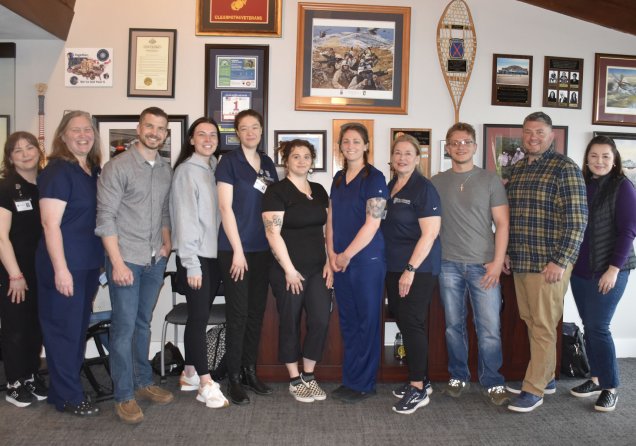 Northeast massage therapy students with Clear Path for Veterans President and CEO Ryan Woodruff, Executive Vice President Alex Behm and Senior Wellness and Guest Experience Manager Bethany Frank.