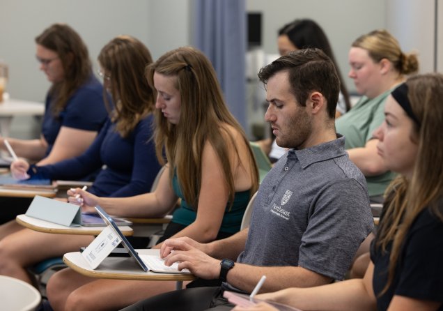 students studying in a lecture hall