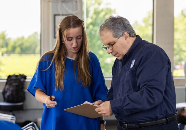 Clinician speaking with a patient