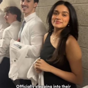 students smiling getting ready for their white coat ceremony