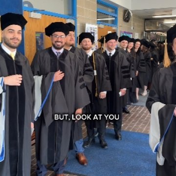 Graduates at commencement getting ready to walk into the Ceremony