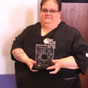 Phyllis from Northeast College's 43 North cafe being presented the prestigious Hallmark Management Service's President’s Award for outstanding Customer Service, leadership and community service.