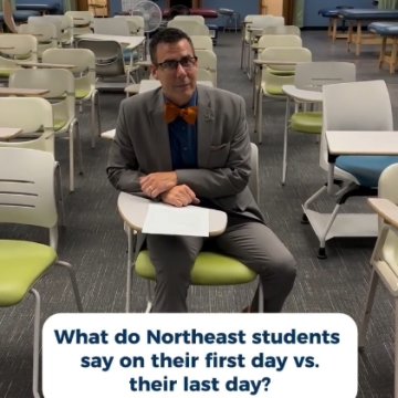 A professor in a gray suit and orange bow tie sitting alone in an empty classroom, with text reading "What do Northeast students say on their first day vs. their last day?"