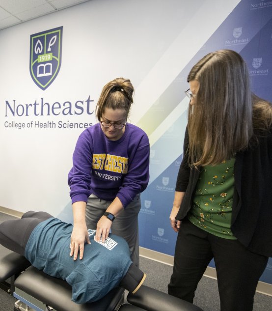 Student participating in chiropractic instruction
