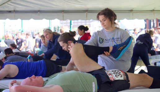 Northeast chiropractic workers in tent at fitness event