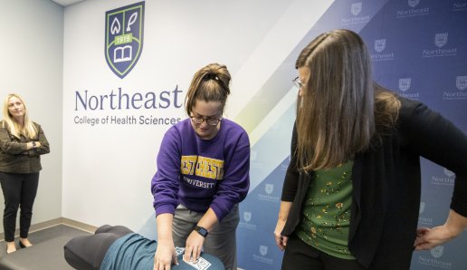 Student participating in chiropractic instruction