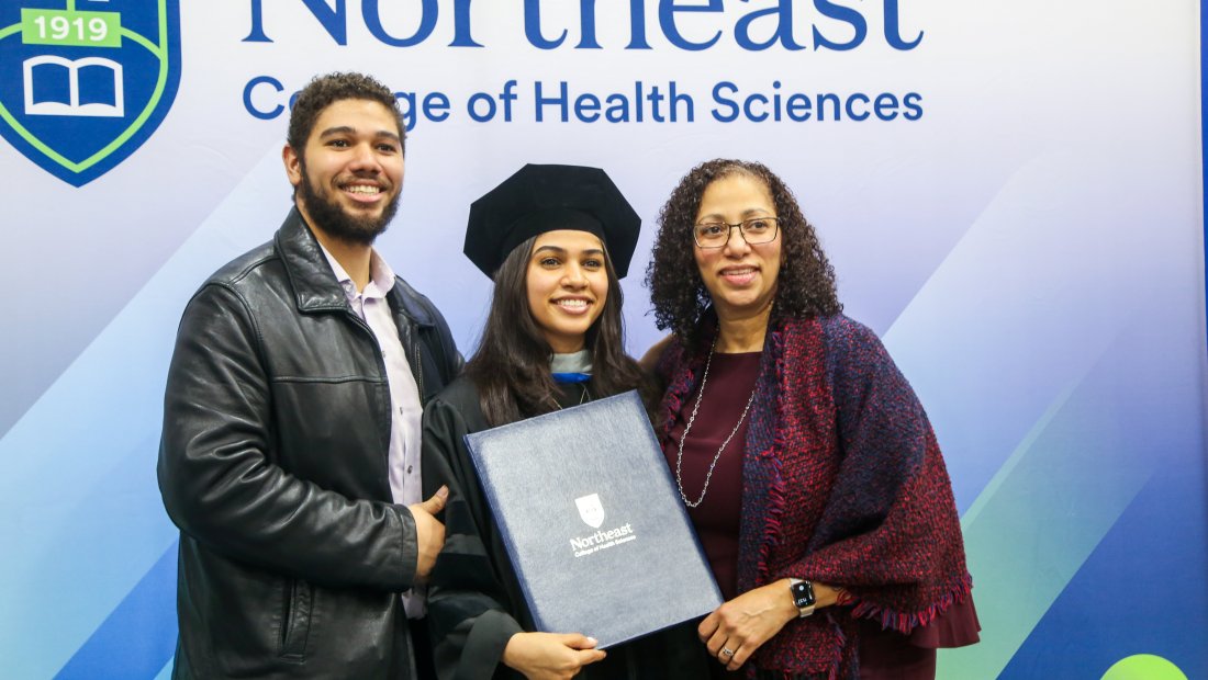 Family taking a photo with their D.C. Graduate
