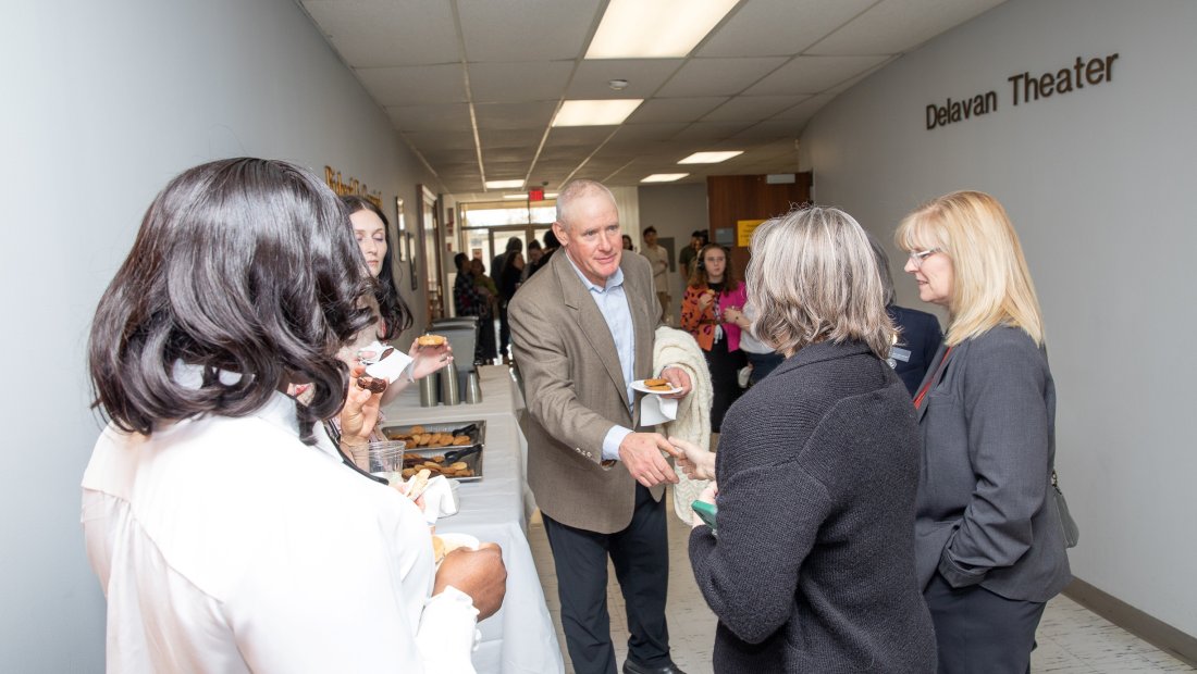 Group of undergrads talking at Pinning ceremony