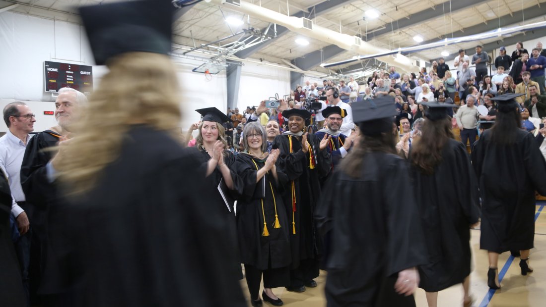 Graduates walking at Commencement