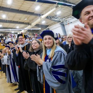 Graduates walking at Commencement