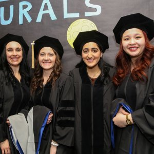Graduates posing for a photo at Commencement