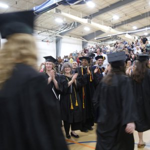 Graduates walking at Commencement